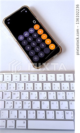 Smartphone Calculator Open Above Keyboard, Dosage Calculation For Medication By Nurse, Precise Numeric Interface And Bright Clean Desk For Accurate Administration Smartphone Calculator Open Above Keyboard, Dosage Calculation For Medication By Nurse, Precise Numeric Interface And Bright Clean Desk For Accurate Administration 136102236