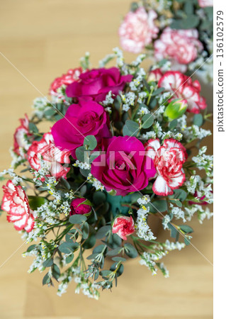 Colorful flower arrangement on the table Colorful flower arrangement on the table 136102579