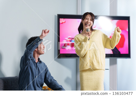 Couple on a karaoke date Couple on a karaoke date 136103477