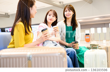 Three women chatting at the airport. Photo courtesy of Kansai International Airport (KIX). Three women chatting at the airport. Photo courtesy of Kansai International Airport (KIX). 136103506