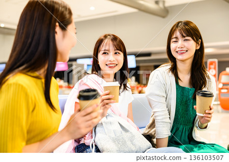 Three women chatting at the airport. Photo courtesy of Kansai International Airport (KIX). Three women chatting at the airport. Photo courtesy of Kansai International Airport (KIX). 136103507