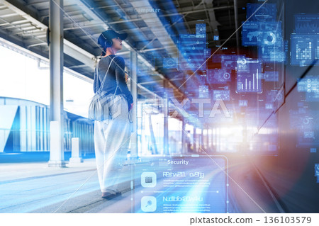 A woman checking information at a futuristic station A woman checking information at a futuristic station 136103579