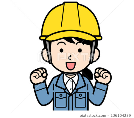 A female site supervisor wearing a helmet pumping her fist 136104289