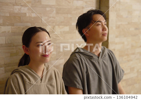 Young couple using the sauna Young couple using the sauna 136104942
