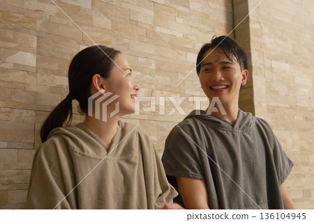 Young couple using the sauna Young couple using the sauna 136104945