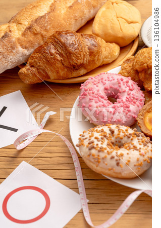 A "yes" or "no" label showing the health risks of high-sugar donuts A "yes" or "no" label showing the health risks of high-sugar donuts 136104986