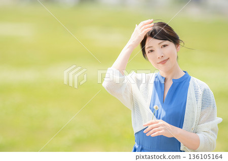 Lawn, flowers and a woman Lawn, flowers and a woman 136105164