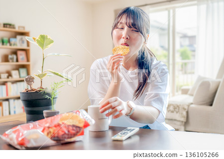 A woman eating sweets 136105266