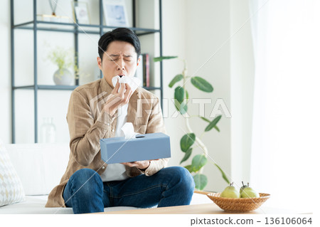 Middle-aged man with hay fever 136106064