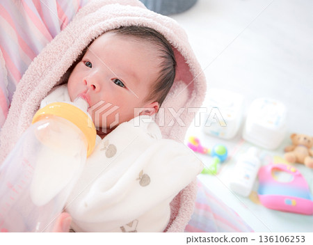 Baby drinking milk 136106253