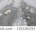 Broken asphalt 136106293