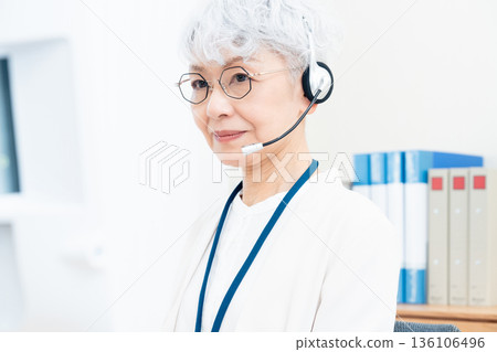 Senior woman working with an intercom 136106496