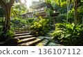 Serene tropical villa surrounded by lush greenery with stone steps leading up to the peaceful retreat on a sunny day. 136107112