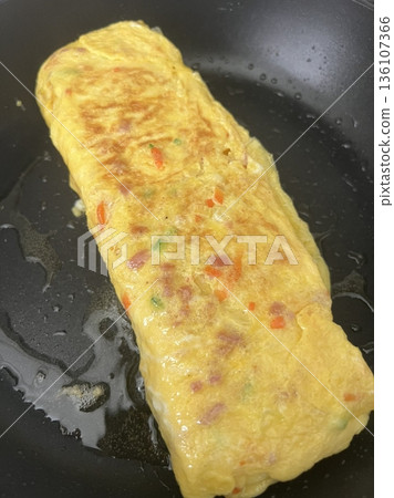 Gyeran-mari or rolled omelette in Korean cuisine is a savory banchan (side dish) made with beaten eggs mixed onion, carrot, Korean zucchini, scallions, and garlic chives. Similiar with tamagoyaki Gyeran-mari or rolled omelette in Korean cuisine is a savory banchan (side dish) made with beaten eggs mixed onion, carrot, Korean zucchini, scallions, and garlic chives. Similiar with tamagoyaki 136107366