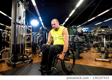 Disabled man training in the gym of rehabilitation center 136107435