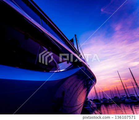 View of harbor with yachts details. Beautiful sunset sky in the marina bay. 136107571