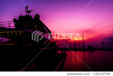 Beautiful view of marina and harbor with yachts and motorboats. Beautiful view of marina and harbor with yachts and motorboats. 136107594