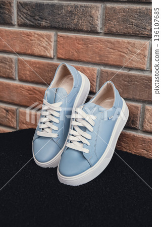Elegant blue leather womens shoes blank product for branding displayed. New casual female sneakers no-brand footwear e-commerce. No logo product unbranded fashion Elegant blue leather womens shoes blank product for branding displayed. New casual female sneakers no-brand footwear e-commerce. No logo product unbranded fashion 136107685