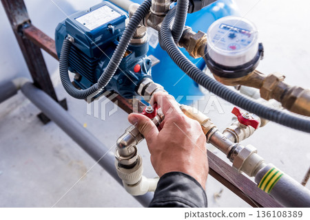 Technician checking water system nodes.Modern Industrial background 136108389