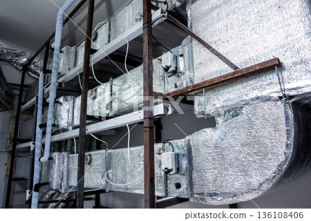 Ventilation pipe system indoors. Modern Industrial background.  136108406