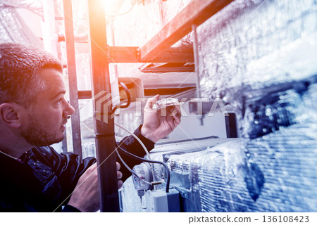 Ventilation cleaning. Specialist at work. Repair ventilation system Ventilation cleaning. Specialist at work. Repair ventilation system 136108423