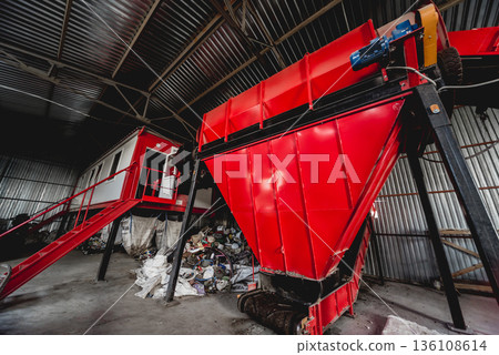 At modern recycling plant. Conveyor belt for transports garbage At modern recycling plant. Conveyor belt for transports garbage 136108614