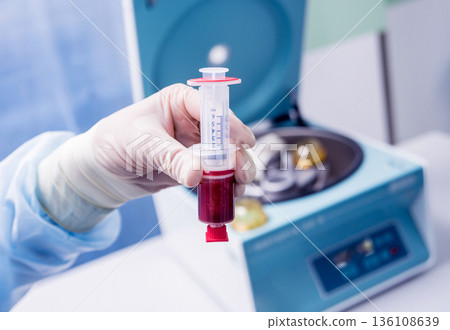 Platelet-Rich plasma preparation. Plasma in syringe. Centrifuge. Platelet-Rich plasma preparation. Plasma in syringe. Centrifuge. 136108639