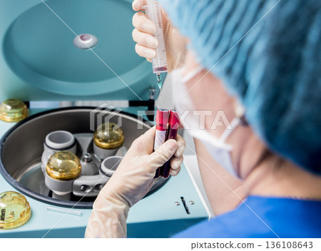 Platelet-Rich plasma preparation. Plasma in syringe. Centrifuge. Platelet-Rich plasma preparation. Plasma in syringe. Centrifuge. 136108643