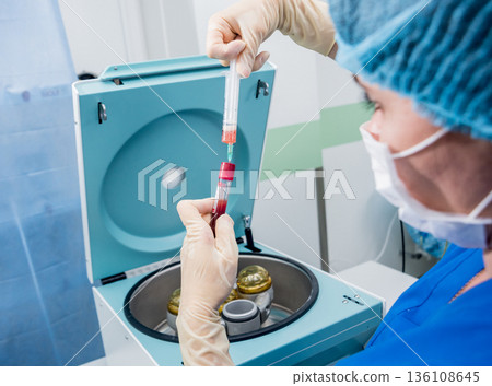 Platelet-Rich plasma preparation. Plasma in syringe. Centrifuge. Platelet-Rich plasma preparation. Plasma in syringe. Centrifuge. 136108645