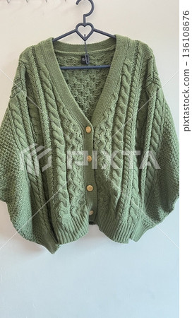 Clothes hanging neatly on hangers under the sun, gently swaying in the breeze—offering a perfect glimpse of fresh laundry days, clean fabric, and simple everyday beauty in every scene. 136108676