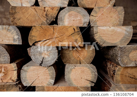 Stack of natural rough wooden boards. Wooden boards, lumber, industrial wood. Stack of natural rough wooden boards. Wooden boards, lumber, industrial wood. 136108704