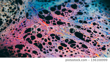 Ink bubble defocused. Spectrum fluid. Colorful fizz liquid texture. Purple blue orange abstract pigment swirl blend on black background. 136108999