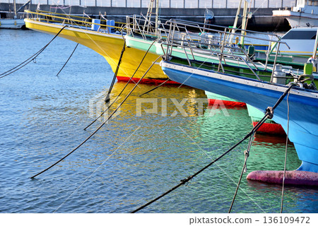 Fishing boats moored side by side at Katase Fishing Port 136109472