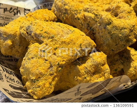 Crispy fried chicken with golden, crunchy skin and juicy, tender meat. A delicious and savory dish, perfect for any meal, served with dipping sauces or side dishes for extra flavor! 136109591