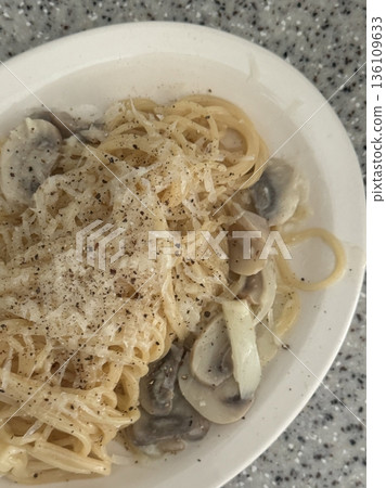 Creamy and rich spaghetti coated in a luscious white sauce, offering a smooth and savory flavor perfect for a comforting and satisfying meal. Creamy and rich spaghetti coated in a luscious white sauce, offering a smooth and savory flavor perfect for a comforting and satisfying meal. 136109633