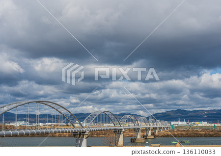 A water pipe bridge over the Yodo River, view from Hirakata City A water pipe bridge over the Yodo River, view from Hirakata City 136110033