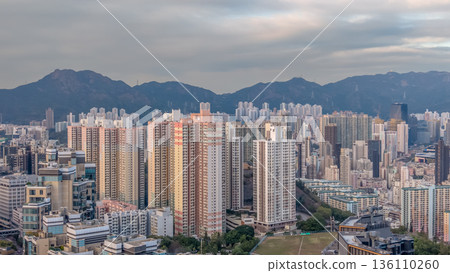 Soft Daylight Illuminates Ho Man Tin Skyline And Mountains 136110260