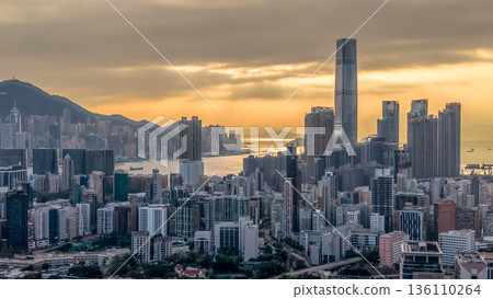 Warm Sunset Illuminates Yau Tsim Mong Skyline And Harbour 136110264