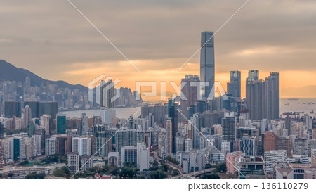 Warm Sunset Illuminates Yau Tsim Mong Skyline And Harbour 136110279