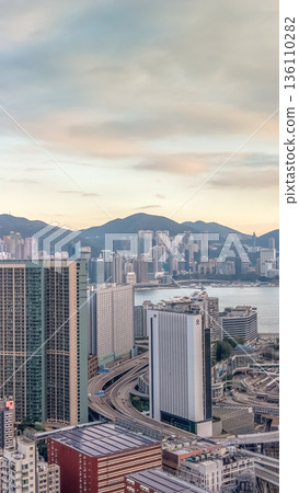 Golden Sunset Illuminates Hung Hom Skyline Facing Victoria Harbour 136110282
