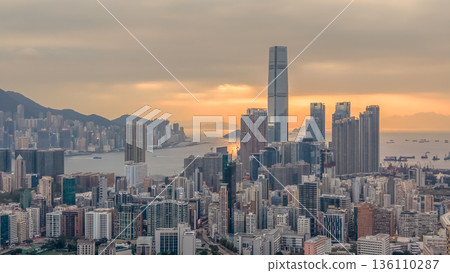 Warm Sunset Illuminates Yau Tsim Mong Skyline And Harbour 136110287