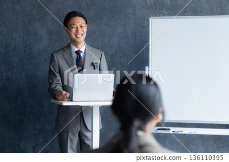 Businessman using a personal computer 136110395