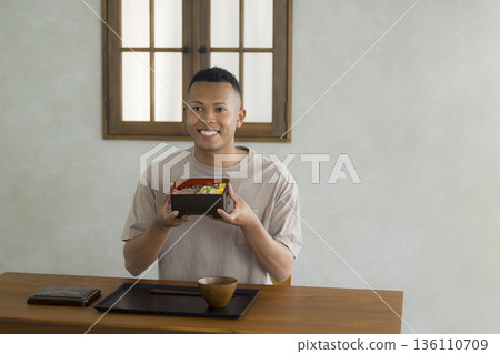 Foreign man enjoying Japanese food Foreign man enjoying Japanese food 136110709