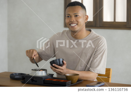 Foreign man enjoying Japanese food Foreign man enjoying Japanese food 136110736