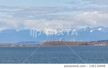 Beautiful landscape view of the sea and Richmond city in British Columbia and beautiful mountains Beautiful landscape view of the sea and Richmond city in British Columbia and beautiful mountains 136110946