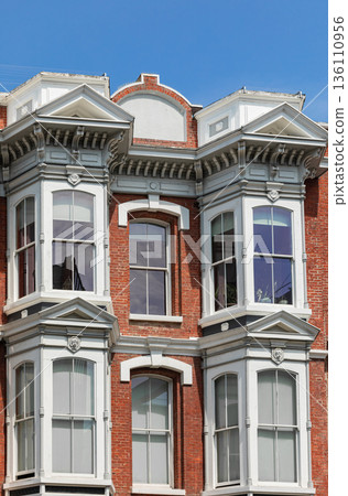 Old Victorian style exterior design windows of the house in old city. 136110956