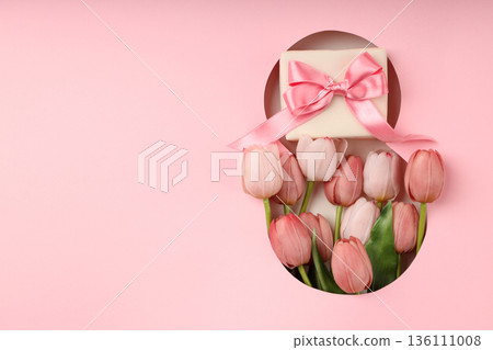 Pink tulips and a gift are perfect for Women's Day celebration Pink tulips and a gift are perfect for Women's Day celebration 136111008
