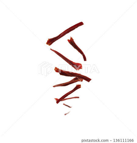 Saffron stamens levitate on a white background 136111166