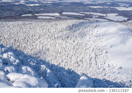 A magnificent winter mountain landscape covered in frost and snow seen from Mt. Mokoto 136111587