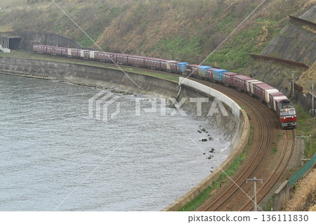 Freight train along the coastline Freight train along the coastline 136111830